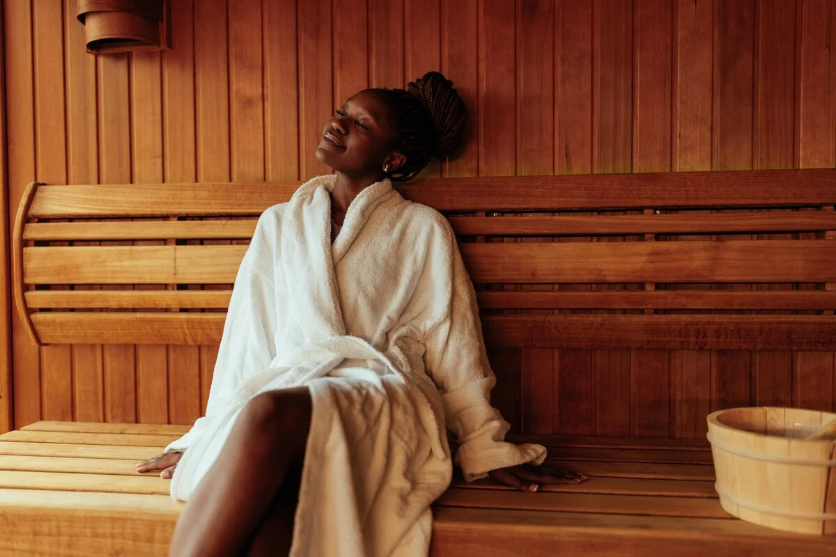 Woman relaxing in sauna at spa
