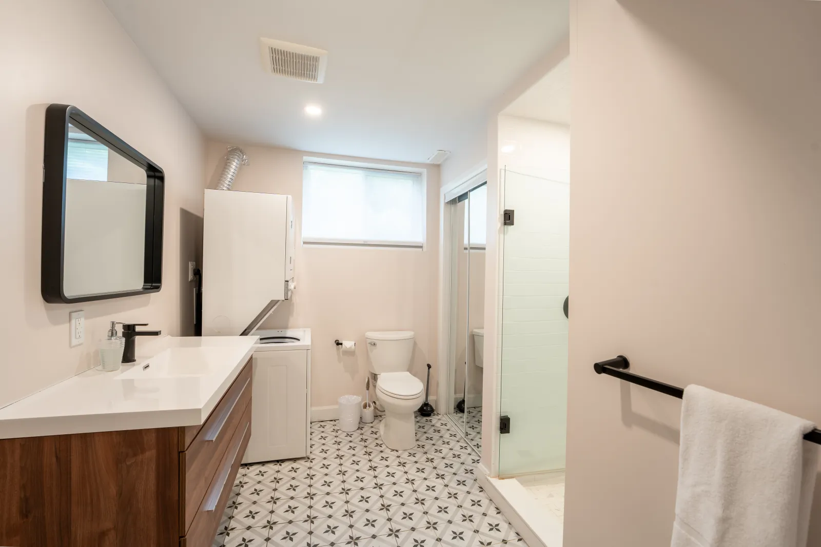 The 44L gallery: bathroom vanity with the laundry beyond