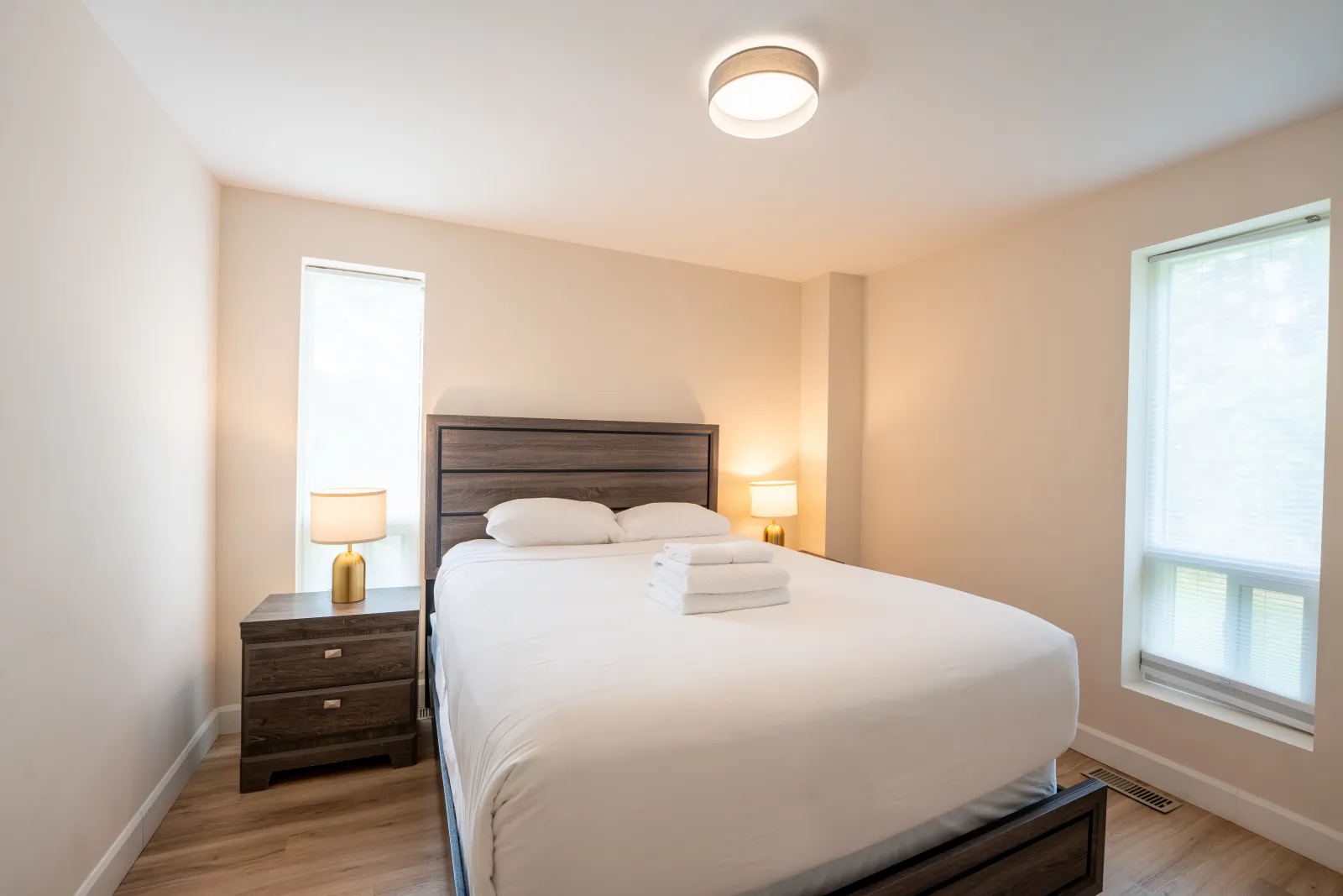The 44L gallery: queen bedroom with two windows
