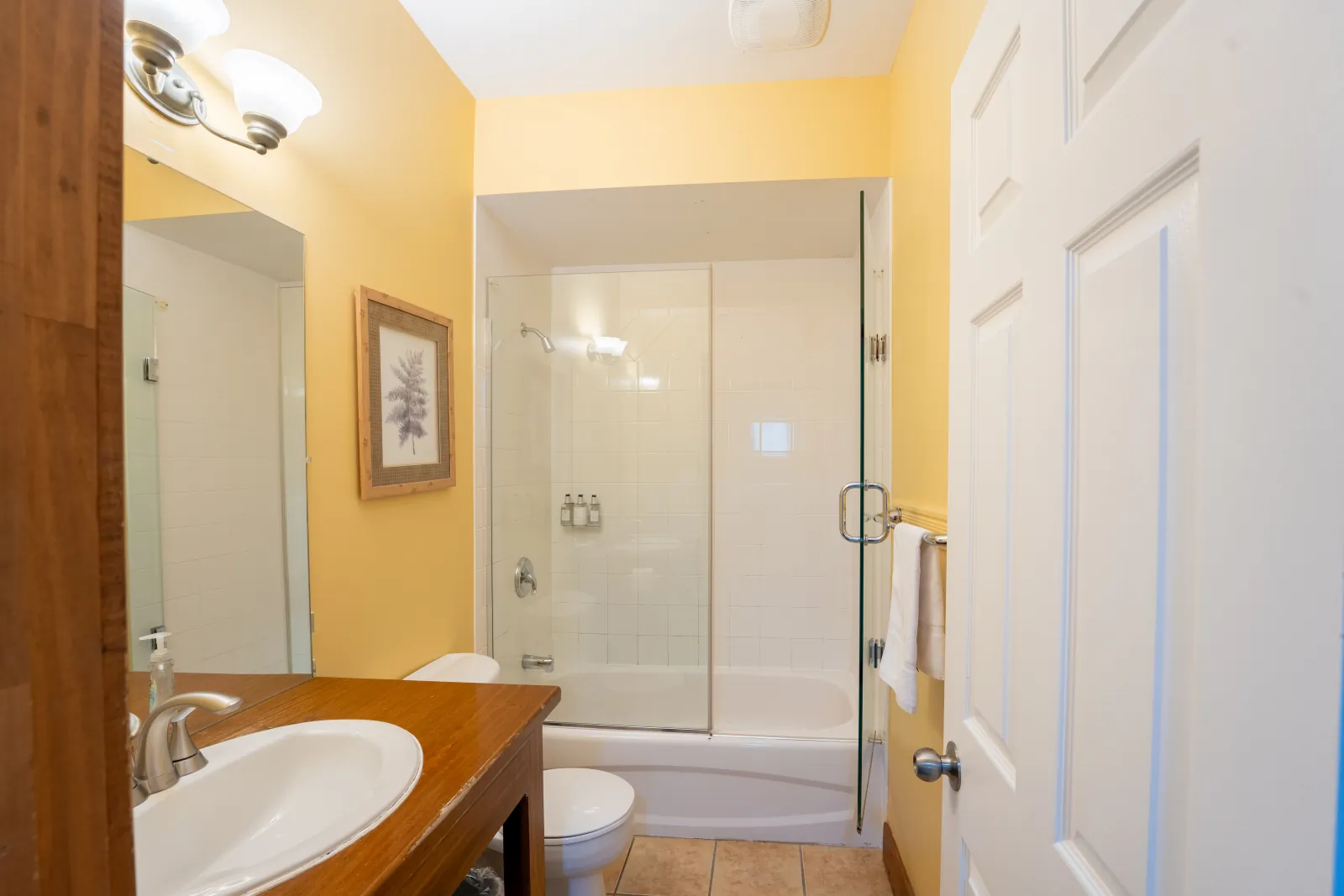 The Aurora gallery: bathroom with a tub and glass shower screen