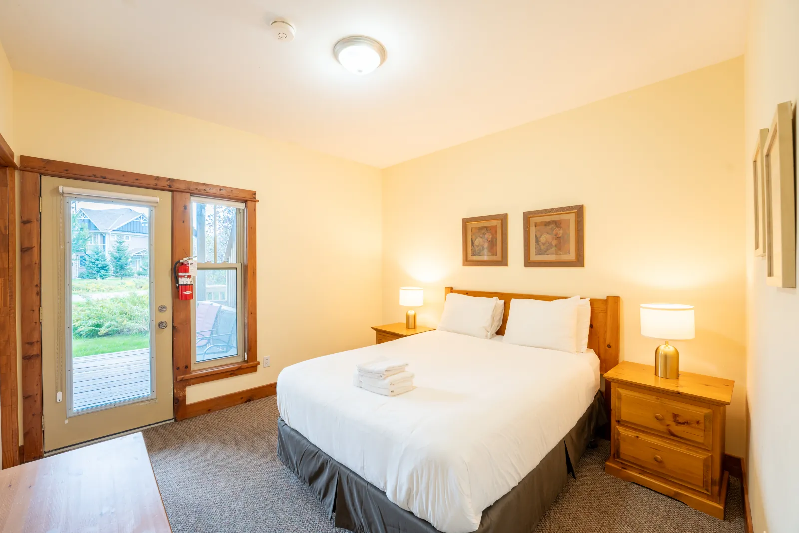 The Aurora gallery: king bedroom with a glass door to the garden