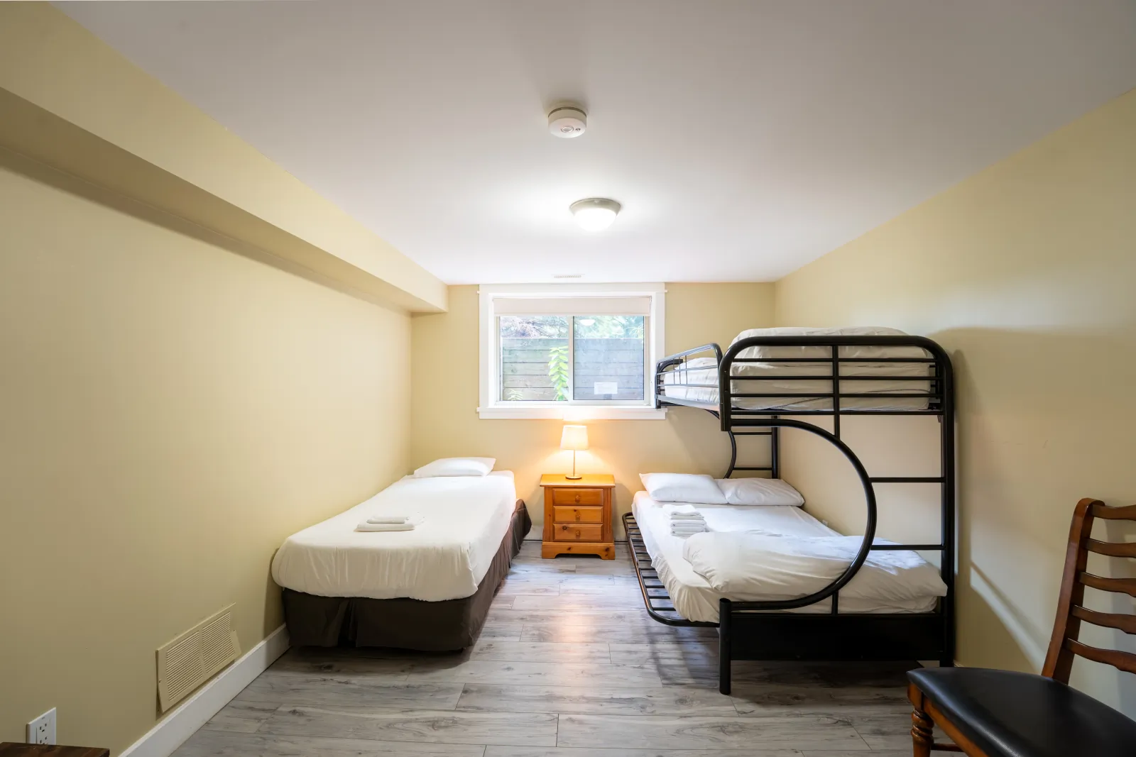 The Aurora gallery: bunk room with a single bed and a black metal bunk