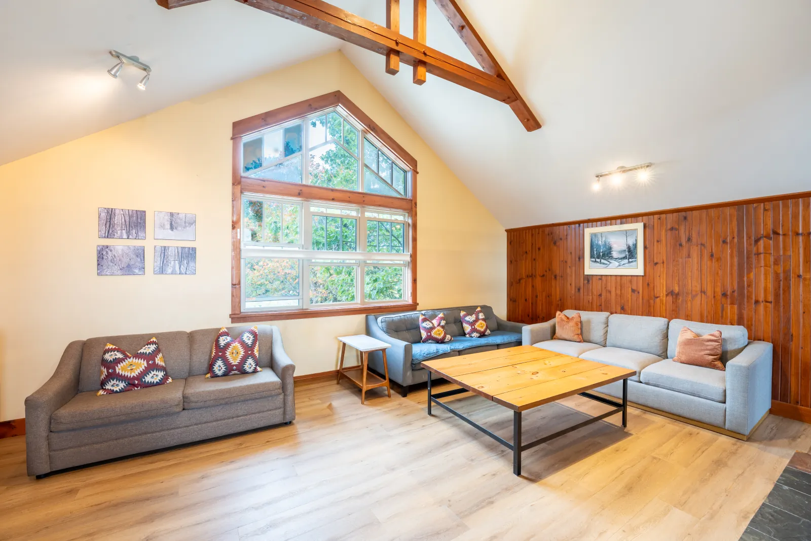 The Aurora gallery: grey sectional and loveseat under the vaulted ceiling