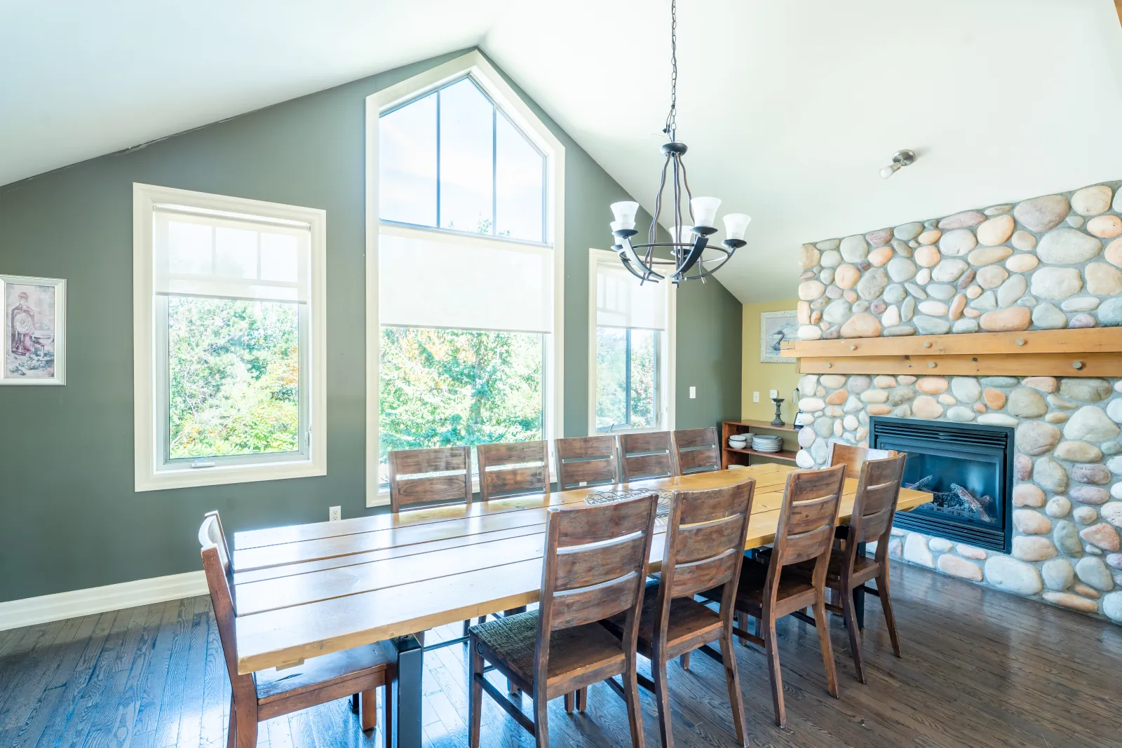 The Corona gallery: dining table beside the stone fireplace – stay near Meaford Curling Club 150th Anniversary Bonspiel
