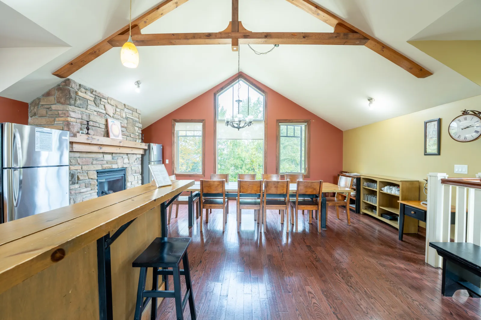 Dining table beside the stone fireplace at The Luna, Blue Mountain – Multi-Family March Break Week Plan, Blue Mountain Ontario
