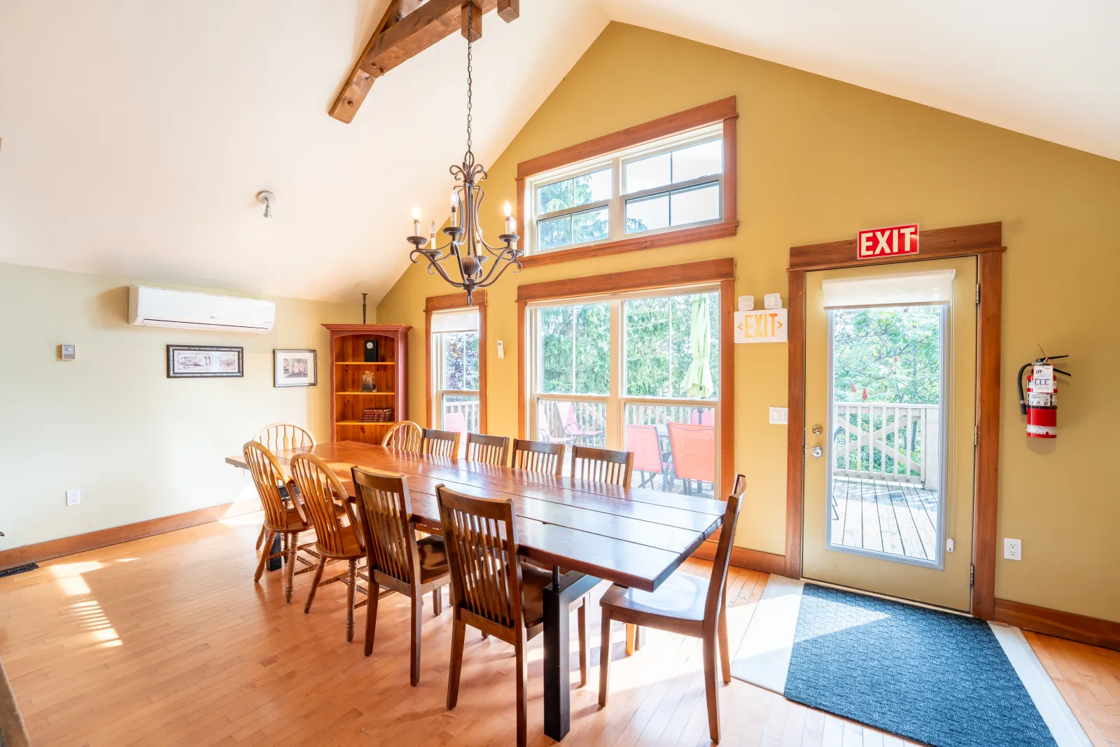 Dining table by the patio door and tall windows at The Omega, Blue Mountain – Fall Colours Weekend Itinerary, Blue Mountain Ontario