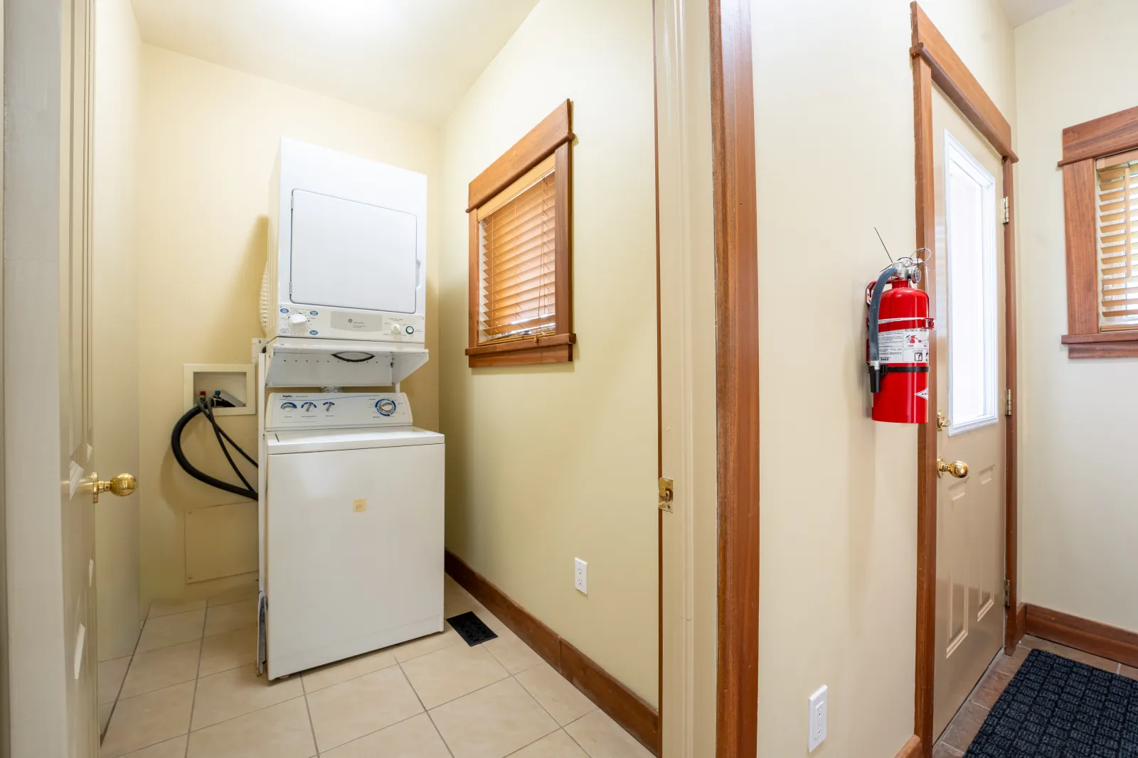 The Omega gallery: laundry closet with a stacked washer and dryer