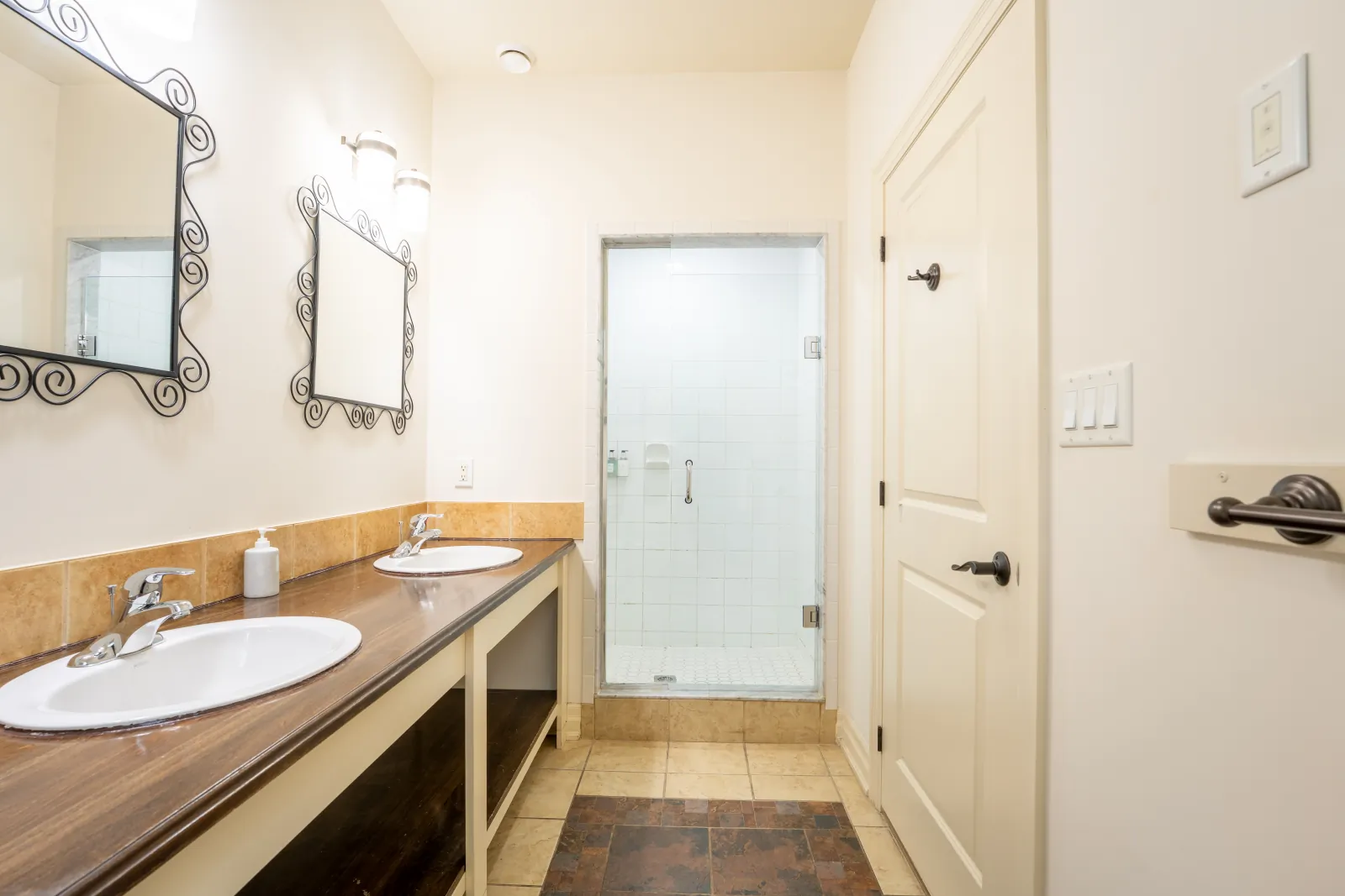 The Prima gallery: double vanity with the glass shower beyond