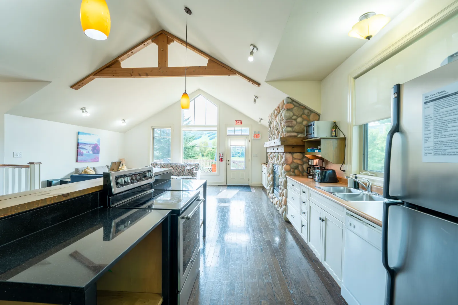 The Prima gallery: kitchen with white cabinets and a dark island