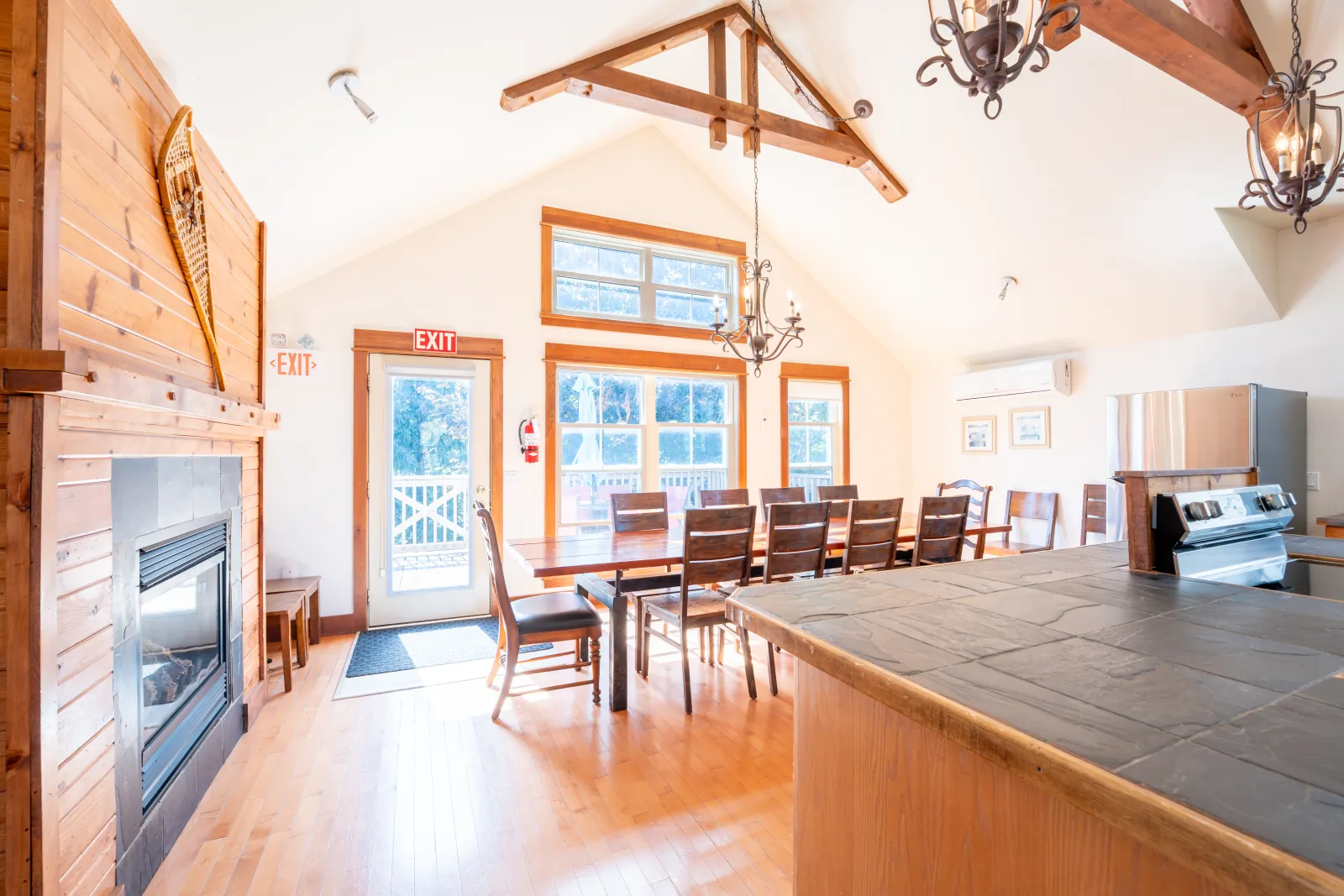 The Vega gallery: great room with the fireplace, dining table and island