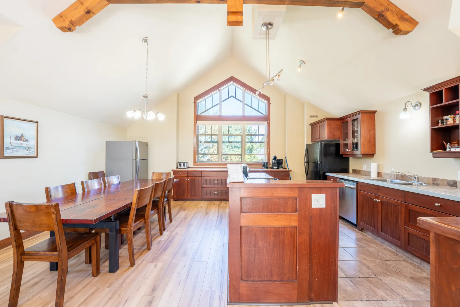The Vista gallery: dining table beside the cherry kitchen and island
