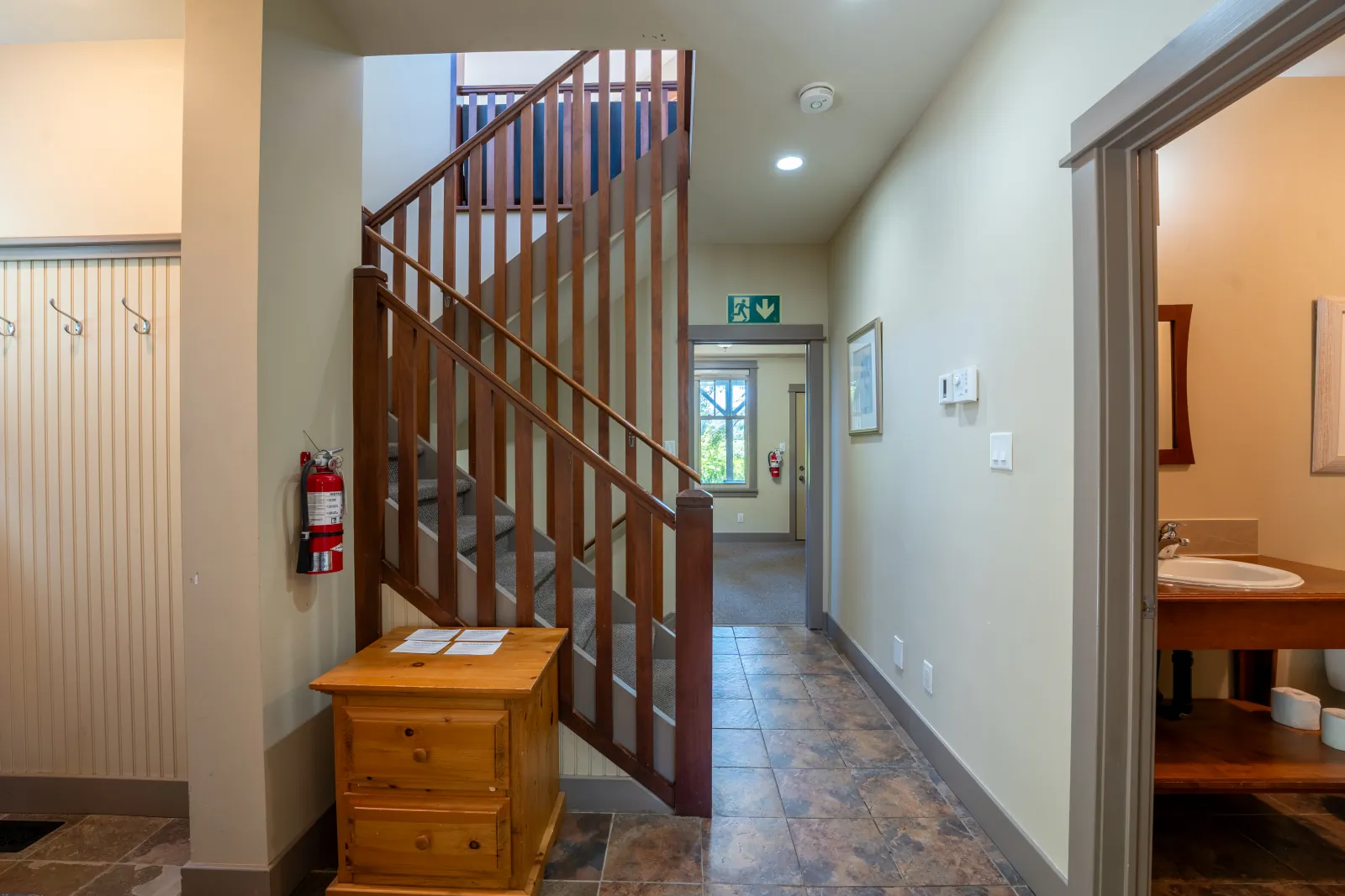The Vista gallery: entry hall with the staircase and a bathroom door