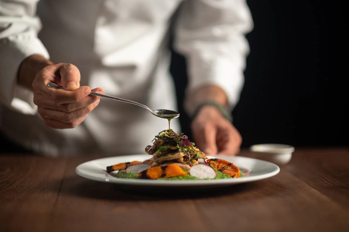 Chef plating gourmet dish